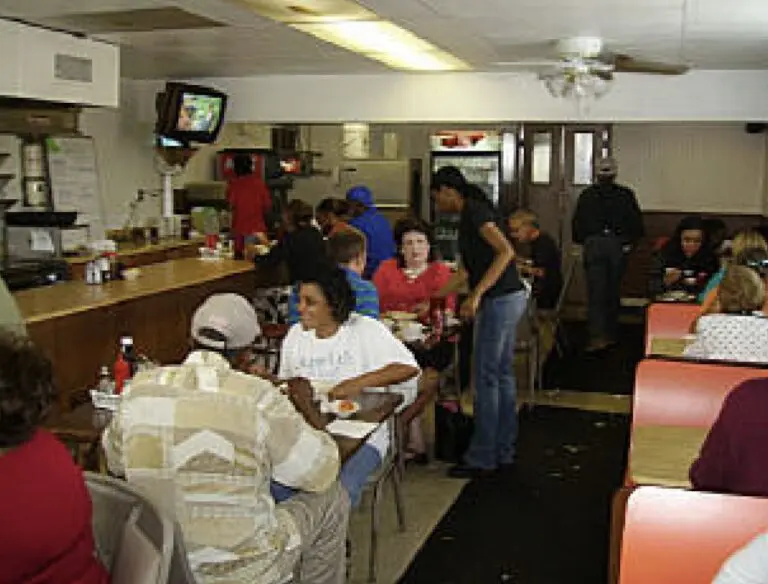 A photo of patrons eating at the Coffee Cup.