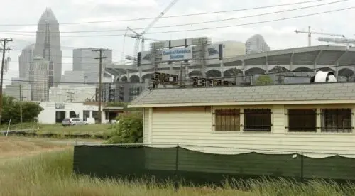 An image of the back of the Coffee Cup with Bank of America Stadium in the background.