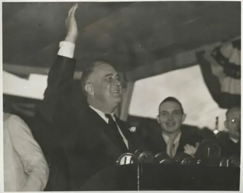 An image of President Franklin Roosevelt waving to the crowd at Memorial Stadium.