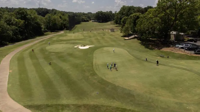 An aerial image of people playing at the golf course.