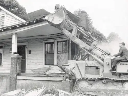 An image of the first house being torn down in Brooklyn.