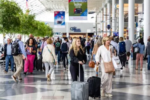 An image of passengers moving through the airport.