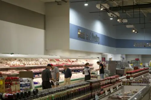 An image of the meat and poultry department at Super G Mart.